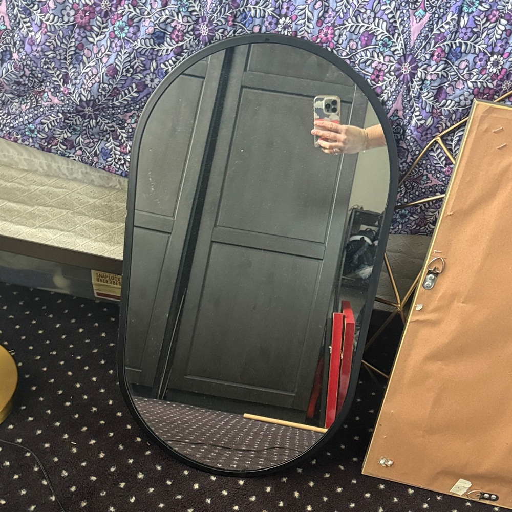 Sleek Black Oval Mirror